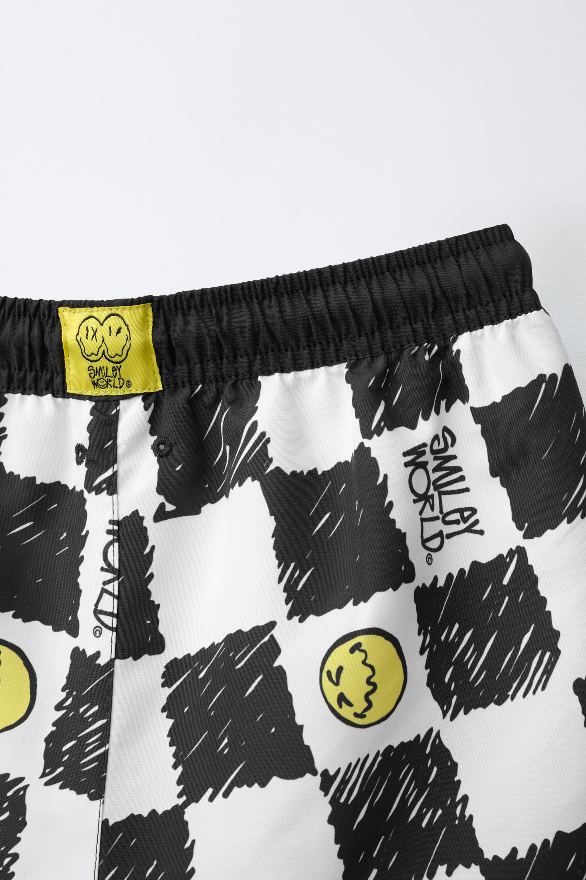 6-14 ANS/ SHORT DE BAIN DAMIER SMILEYWORLD ®
